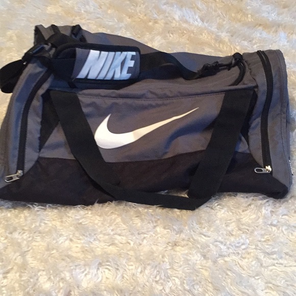 Nike Handbags - Nike grey and white duffle bag